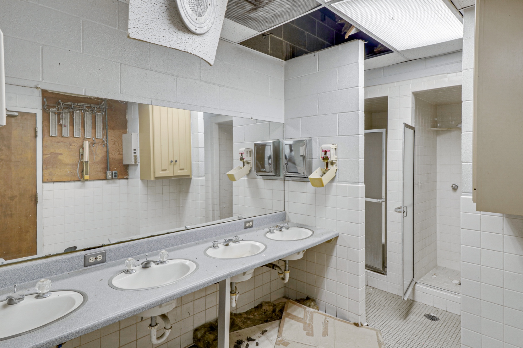 Original restroom vanity with multiple sinks