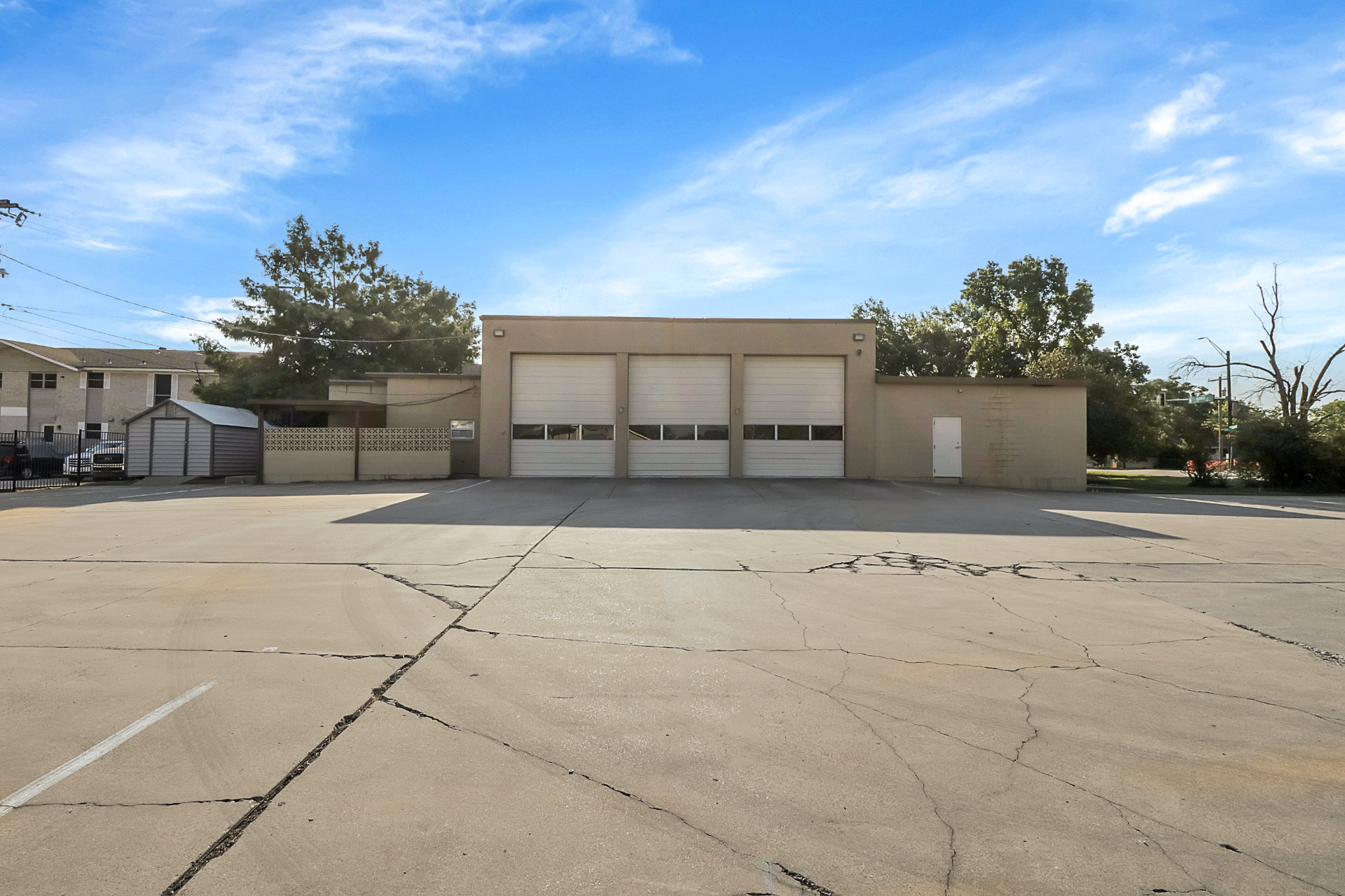 Wide view of three apparatus bay doors from the rear apron